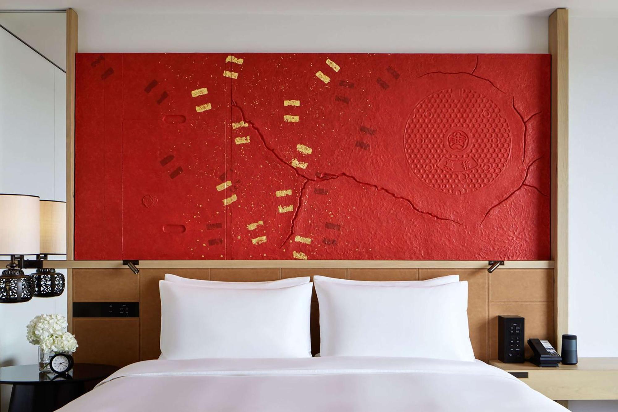 Hyatt Centric Kanazawa Esterno foto A bed with a headboard